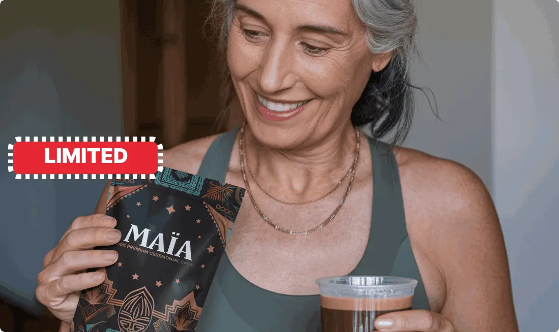 Woman holding a packet of MAÏA cacao and a cup of drink, labeled 'LIMITED.'